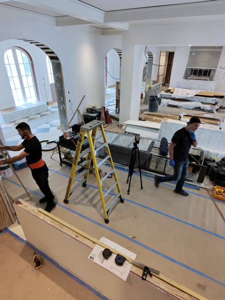 Two installers at work in a home under construction