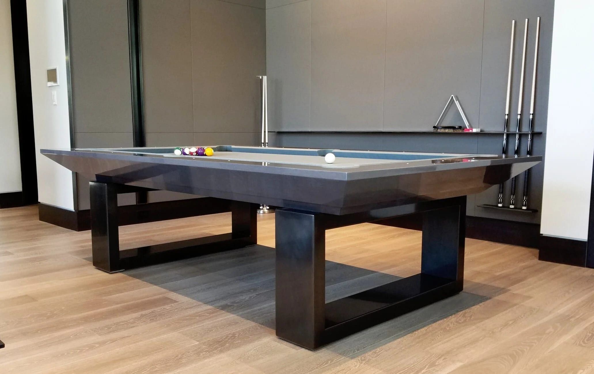 Pool table on a custom blackened steel base