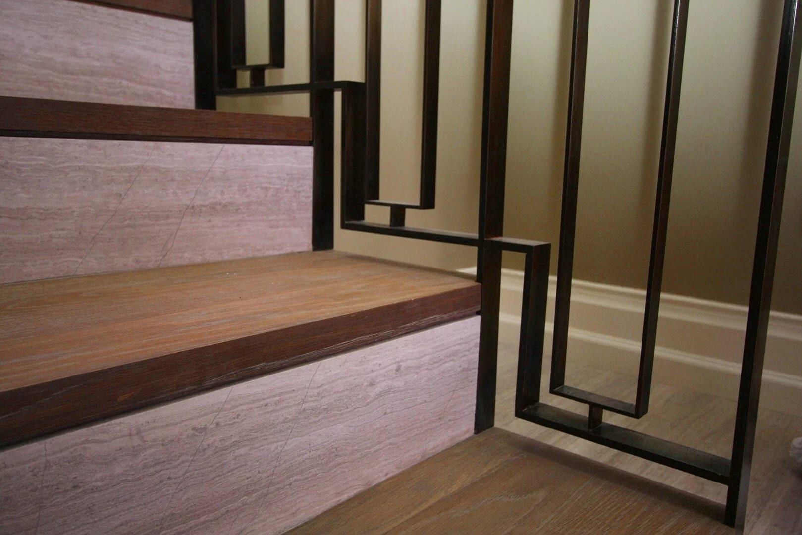 Geometric steel railing panel at a stair landing